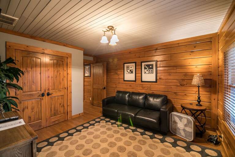 Second living room space with leather sleeper sofa