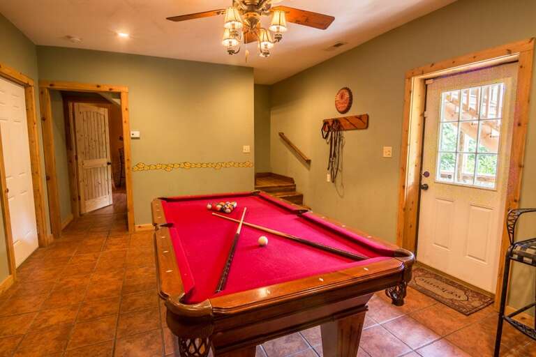 Lower level recreation room with pool table