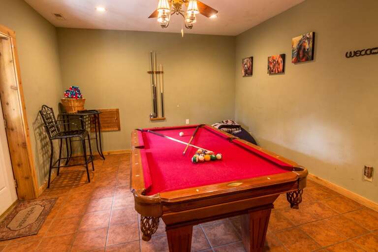 Lower level recreation room with pool table
