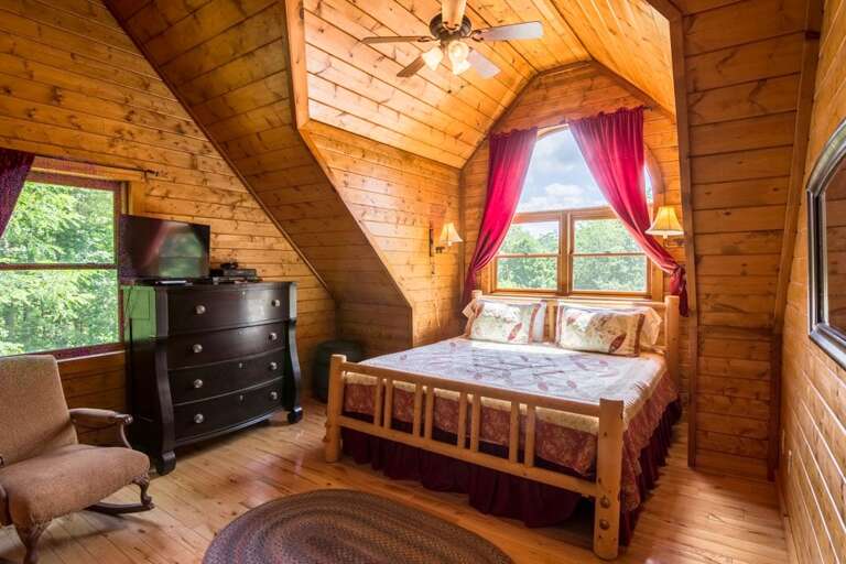 Upper level bedroom with king bed