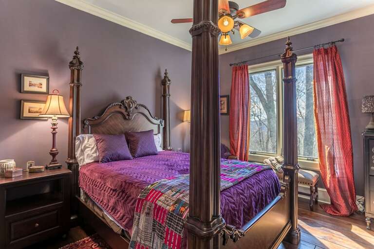 Second bedroom on main level with a queen bed and shared bath