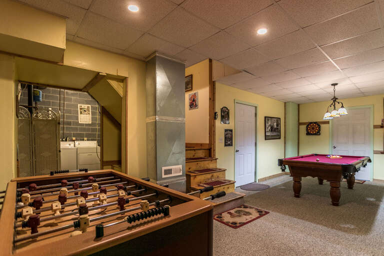 Downstairs game room with Foosball and pool table
