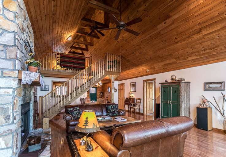 Living room with leather furniture and fireplace