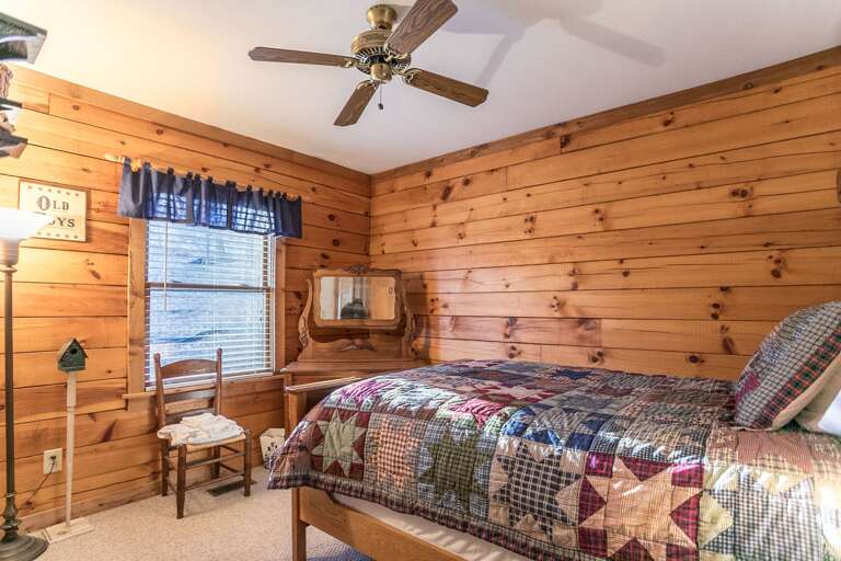 Main level bedroom with full bed