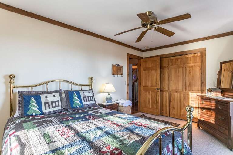 Main level bedroom with queen bed