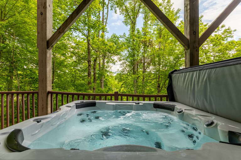 Outdoor Jacuzzi On Wooden Deck With Forest View Outdoor Jacuzzi On Wooden Deck With Forest View