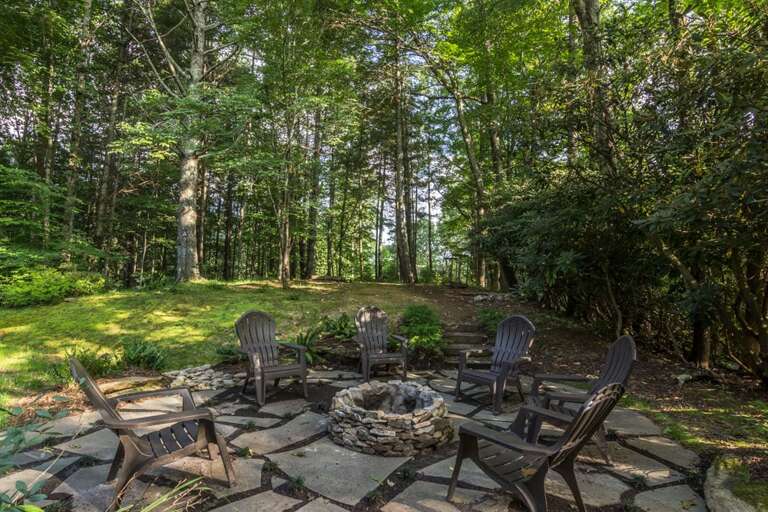 Outdoor fire pit area with chairs