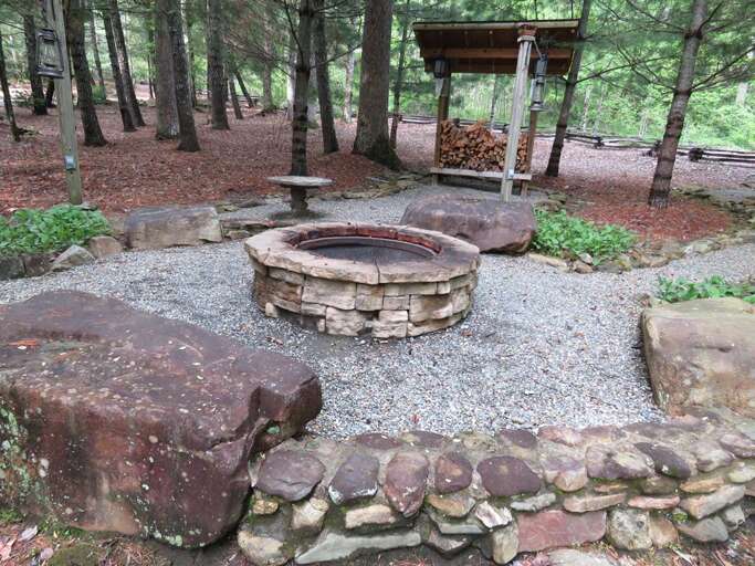 Fire pit with firewood and Bluetooth speakers Fire pit with firewood and Bluetooth speakers