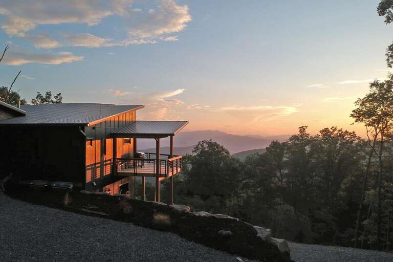sunset behind cabin