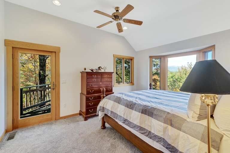 Main floor master with king bed and porch Main floor master with king bed and porch