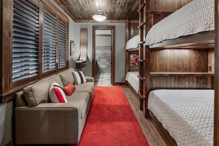 lower level bunk room w 4 queen beds
