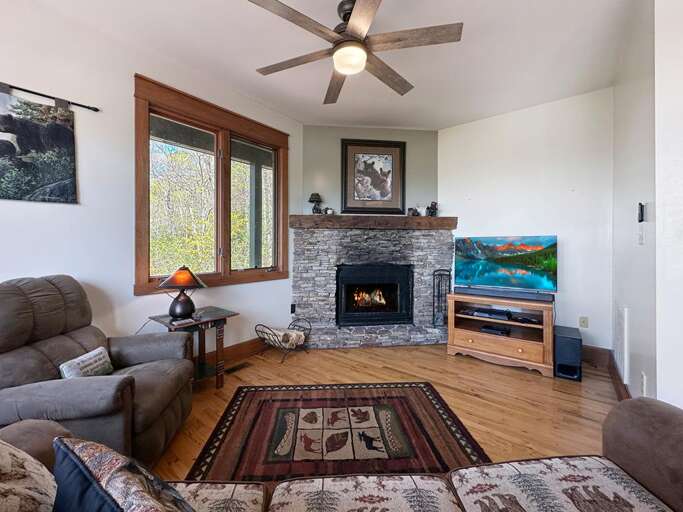 living room with wood burning fireplace