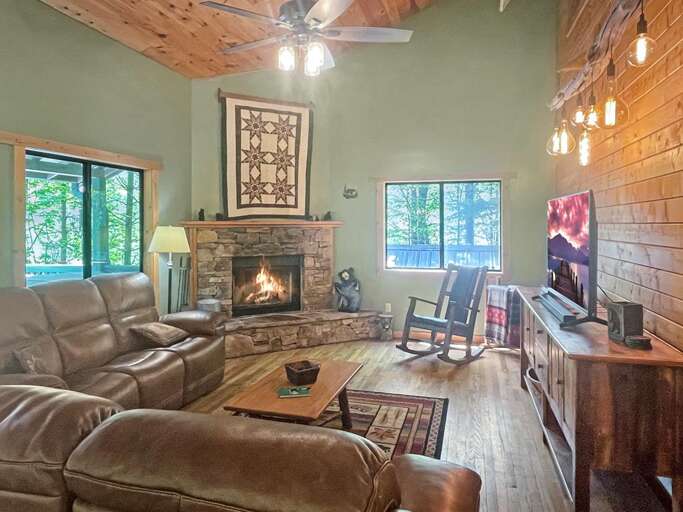 living room with wood fireplace living room with wood fireplace