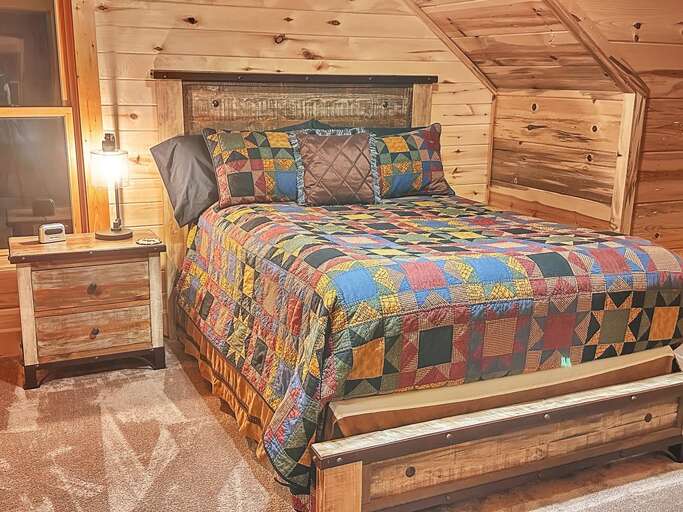 Upper-level left-side queen bedroom