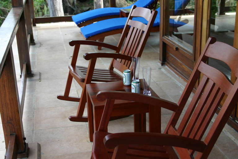 Enjoy rocking chairs and chaise lounges on the veranda