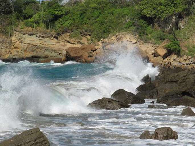 Pacific surf meets Redonda Bay rocks from private beach