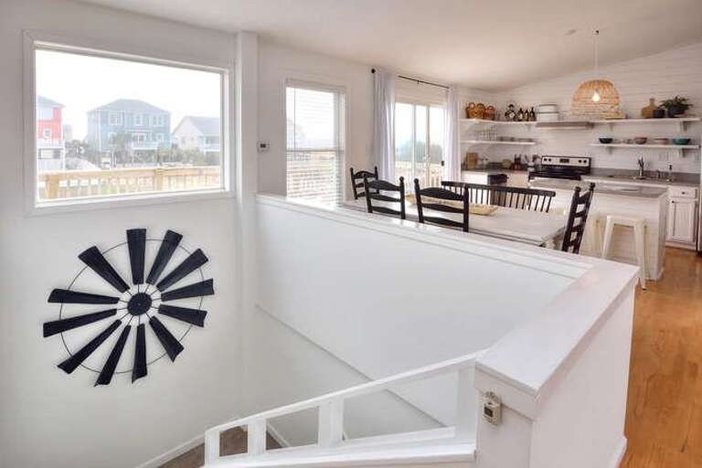 2017 W Pelican Dr Oak Island-small-008-6-StairwellDiningKitchen-666x444-72dpi