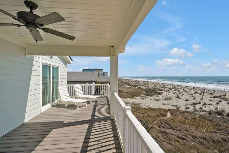 2nd Level Deck View of Ocean with lounge chairs
CG 2.2023