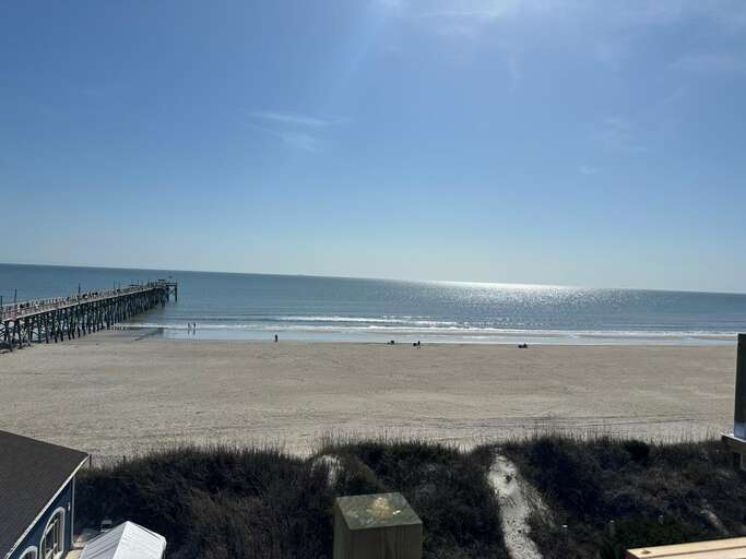 Sunlit Shore, Distant Dock, Shimmering Sea