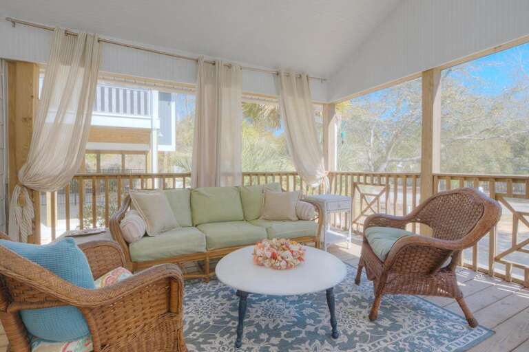 Wicker Chairs, Soft Sofa, Round Table, Airy Curtains