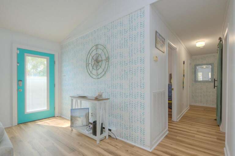 Turquoise Door, Textured Wall, Wooden Floor, Hallway View