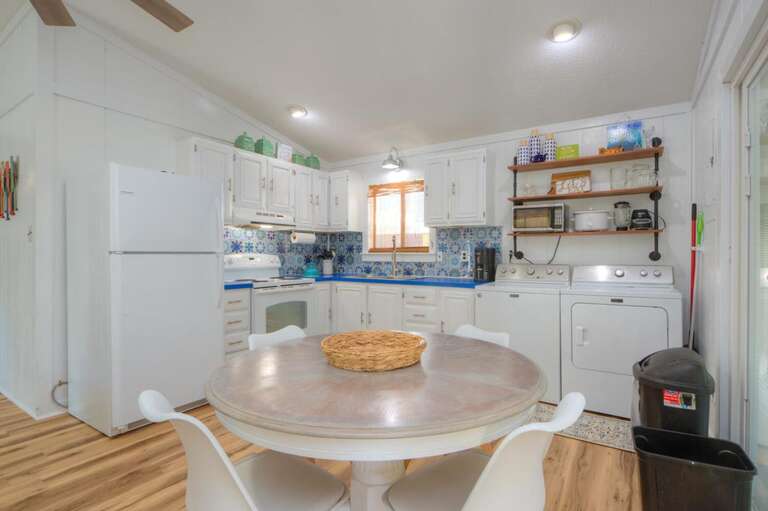 Kitchen Corner, Circular Table, Blue Accents, White Cabinets