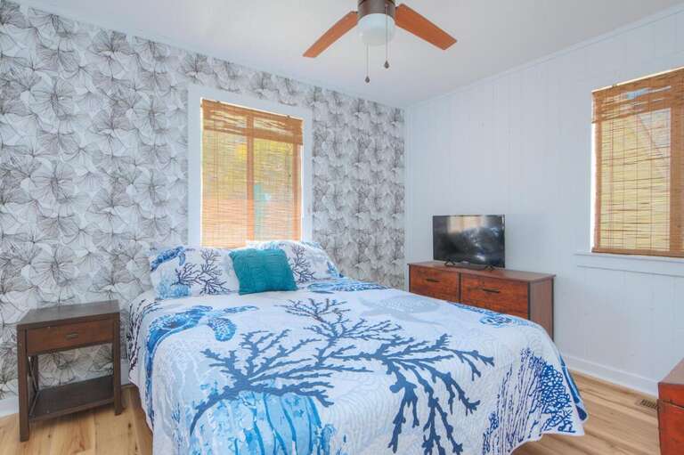 Bed, Blue Coral Quilt, Floral Wallpaper, Wooden Blinds