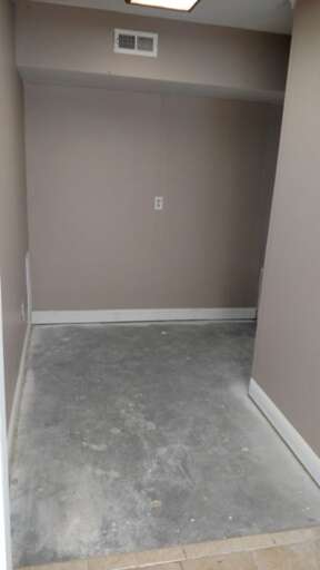 space that leads to restroom entryway on right
