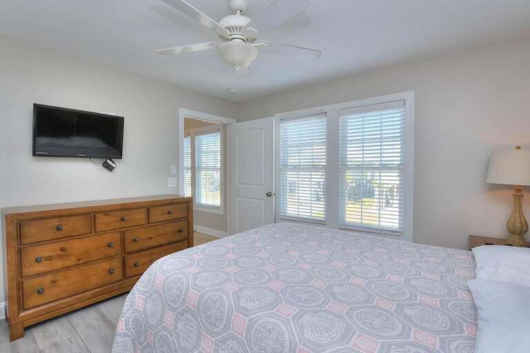 Pink and Grey Queen Bedroom with Street View