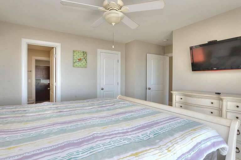 Striped King Bedroom with TV and Dresser