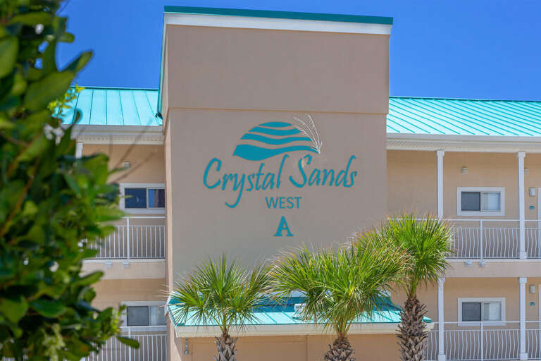 Crystal-Sands-Building-A-Sign