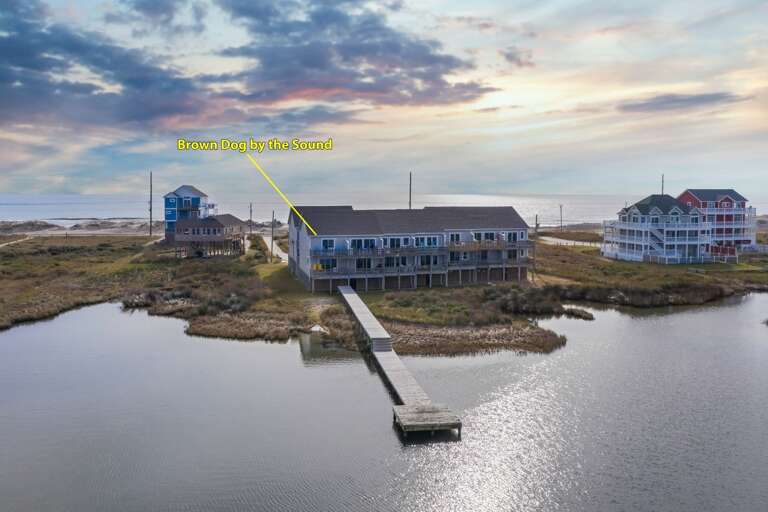 Coastal Landscape With Houses And Pier At Sunset Coastal Landscape With Houses And Pier At Sunset