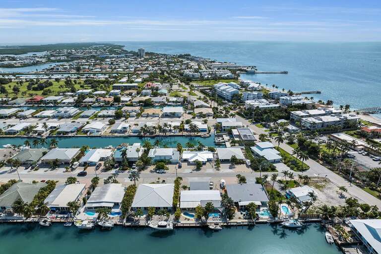 Aerial View Of Coastal Town With Buildings And Waterways