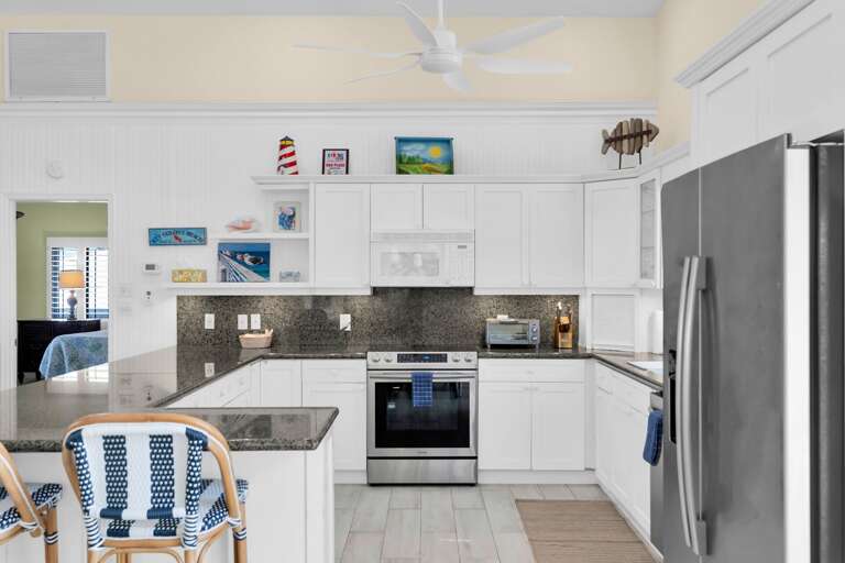 Residential Kitchen Interior With Appliances And Dining Area Residential Kitchen Interior With Appliances And Dining Area