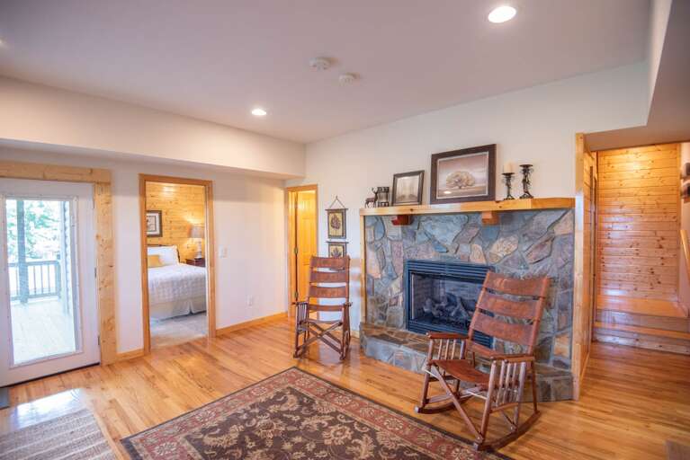 Lower level fireplace and rocking chair...