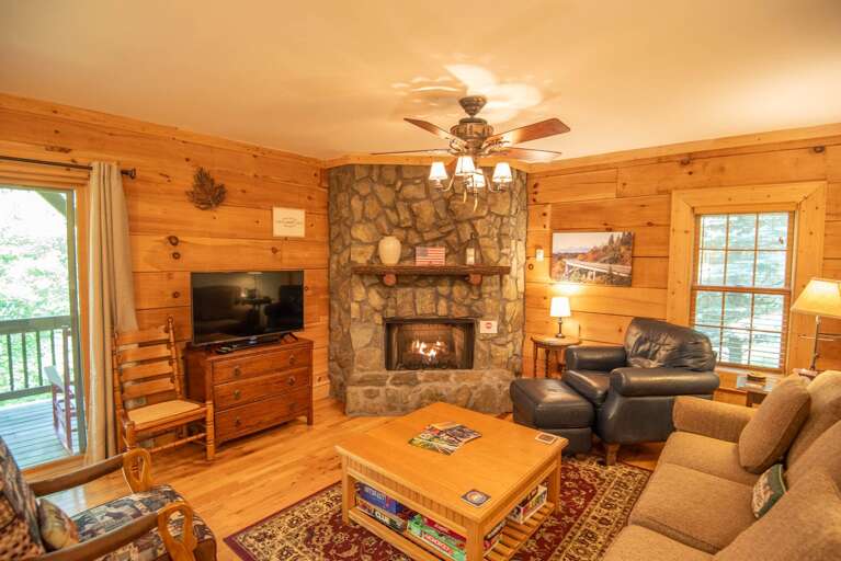 Stone-stacked fireplace and big TV...