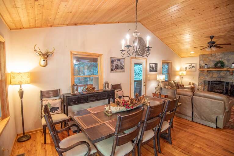 Family style dining room with vaulted ceilings...