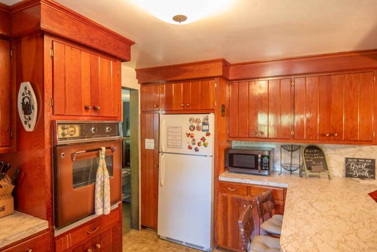 Stove, microwave and bar seating...