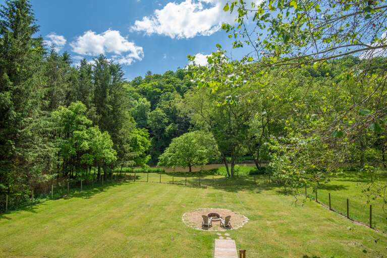 View from your deck over your fire pit to your piece of the river...