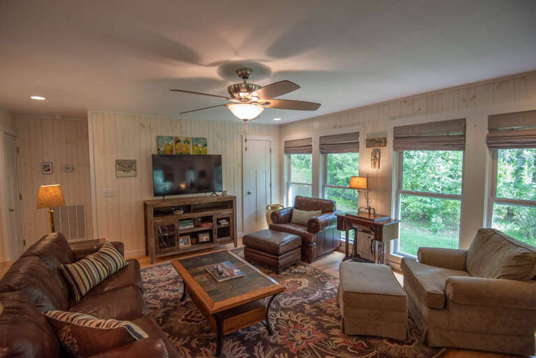 Living area with plenty of seating and a Big Smart TV...