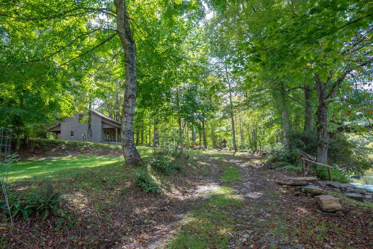 Quintessential cabin experience on the New River, welcome to Spout Branch in Warrensville NC.