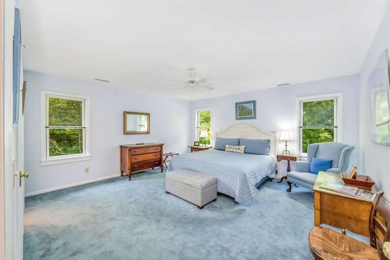 Main floor primary bedroom with king bed...