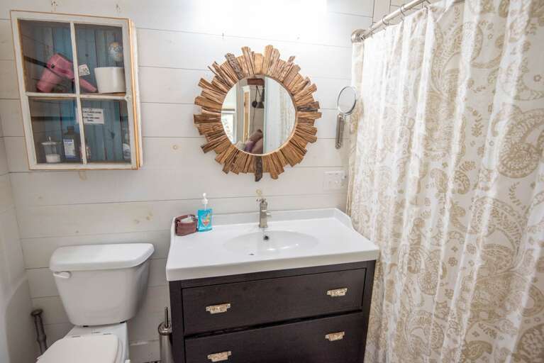 Full bathroom with tub/shower combo...