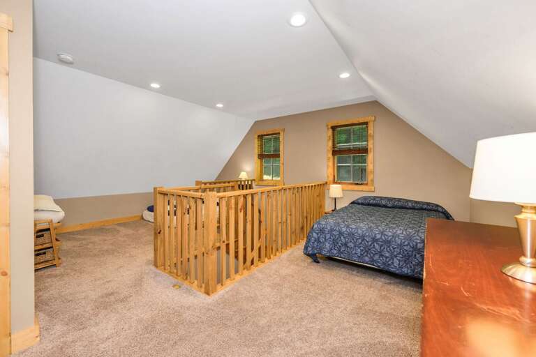 Loft bedroom with 2 double beds and a twin...