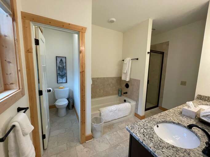 Full bathroom with tub and shower...