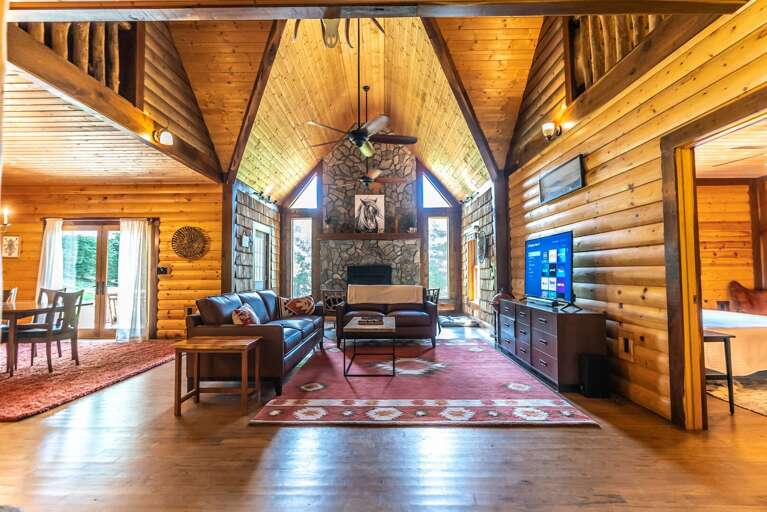 Open living area with souring fireplace...