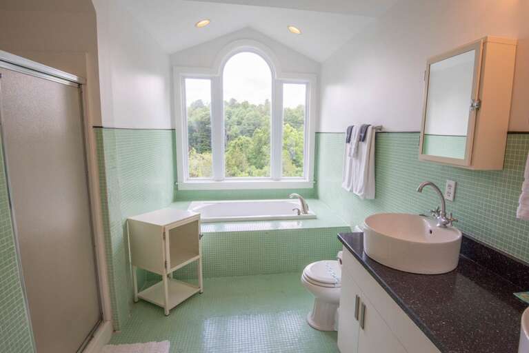 And full bathroom with soaking tub and shower...