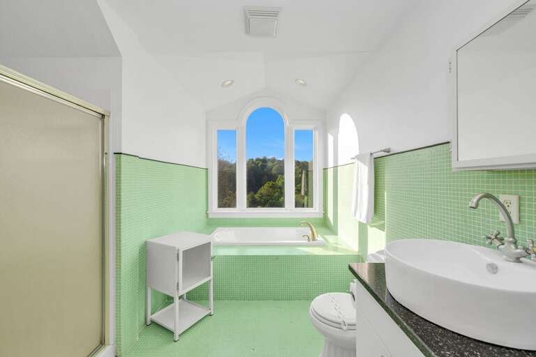 Upstairs bathroom with shower and soaking tub...