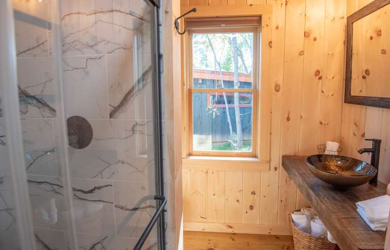 Full bathroom with unique sink...