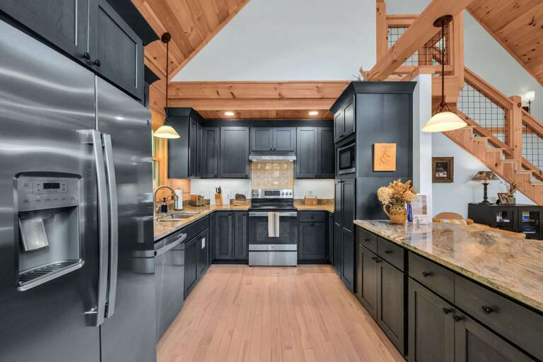 Fully equipped kitchen with quartzite countertops and hand painted tiles